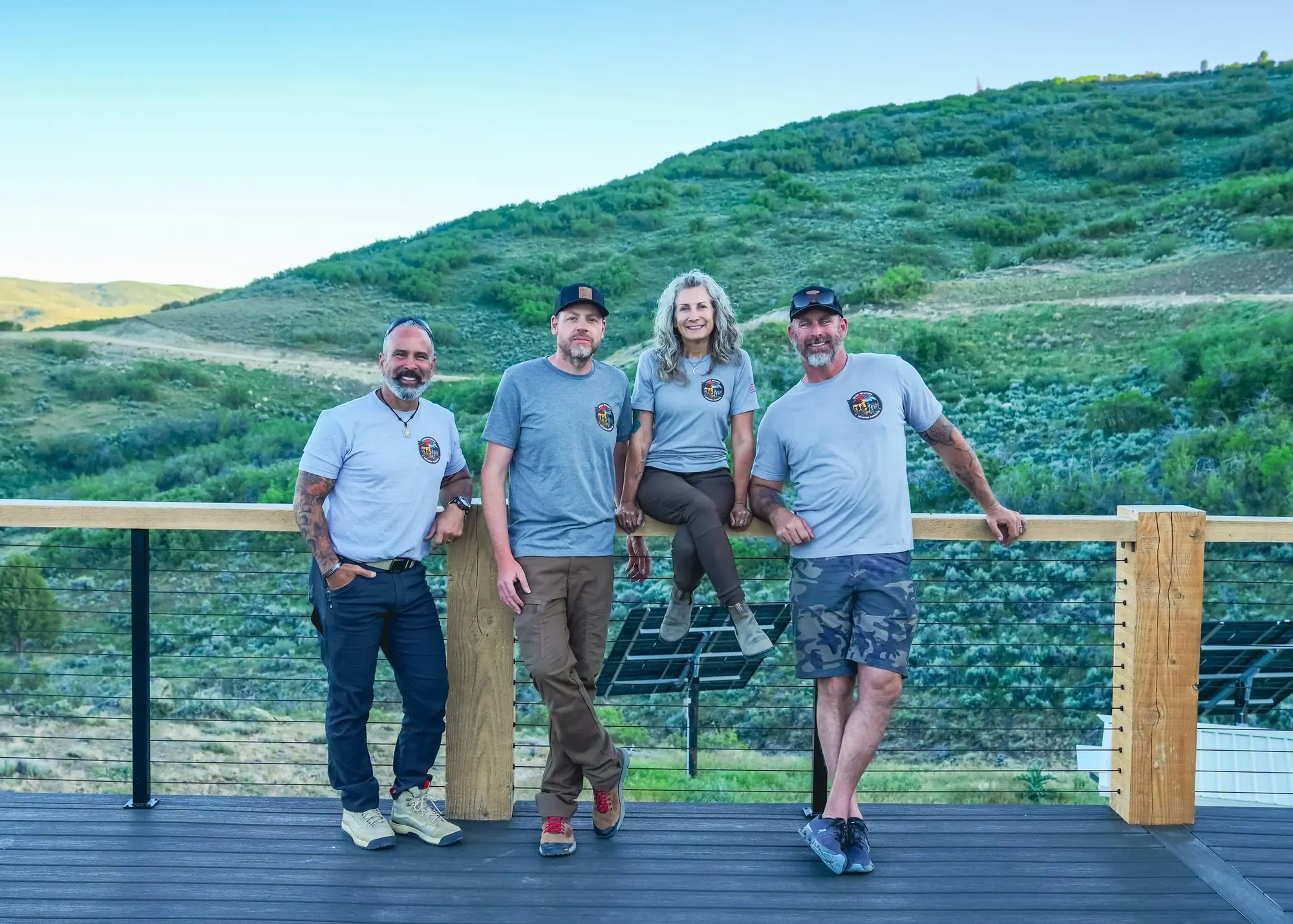 SOAF team members on a deck overlooking the mountains